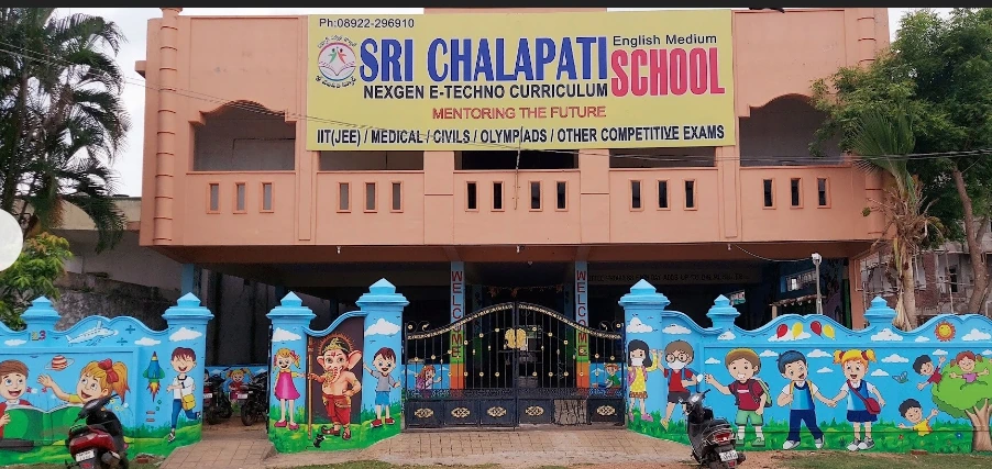 Sri Chalapati School exterior showing the school sign and main entrance